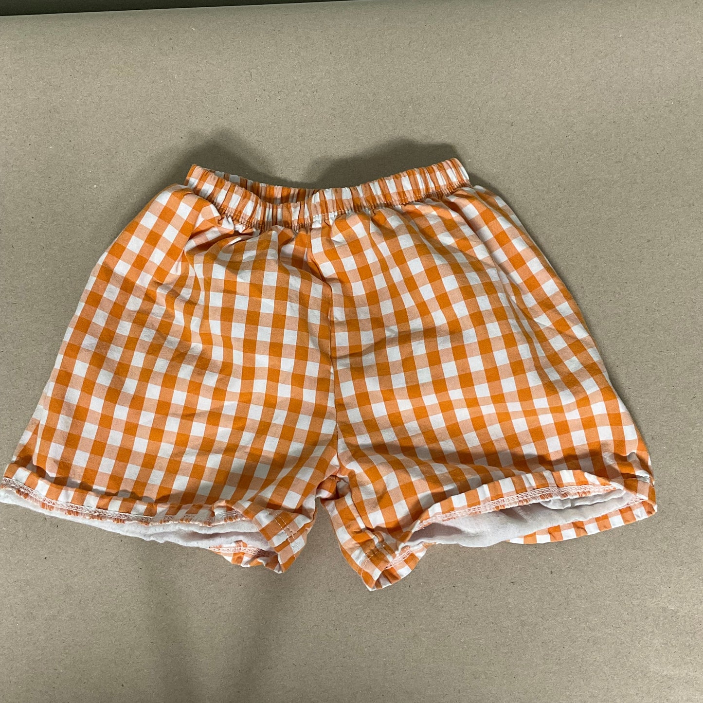 Orange/white gingham shorts