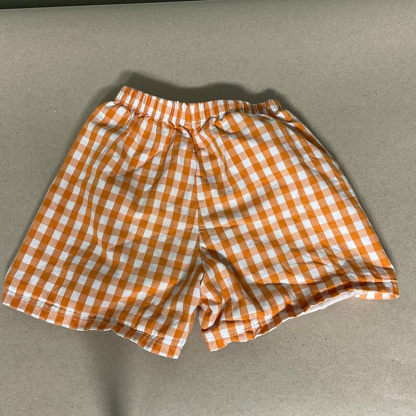 Orange/white gingham shorts